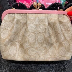 Signature Canvas Tan/Pink Colored Coach Bag.